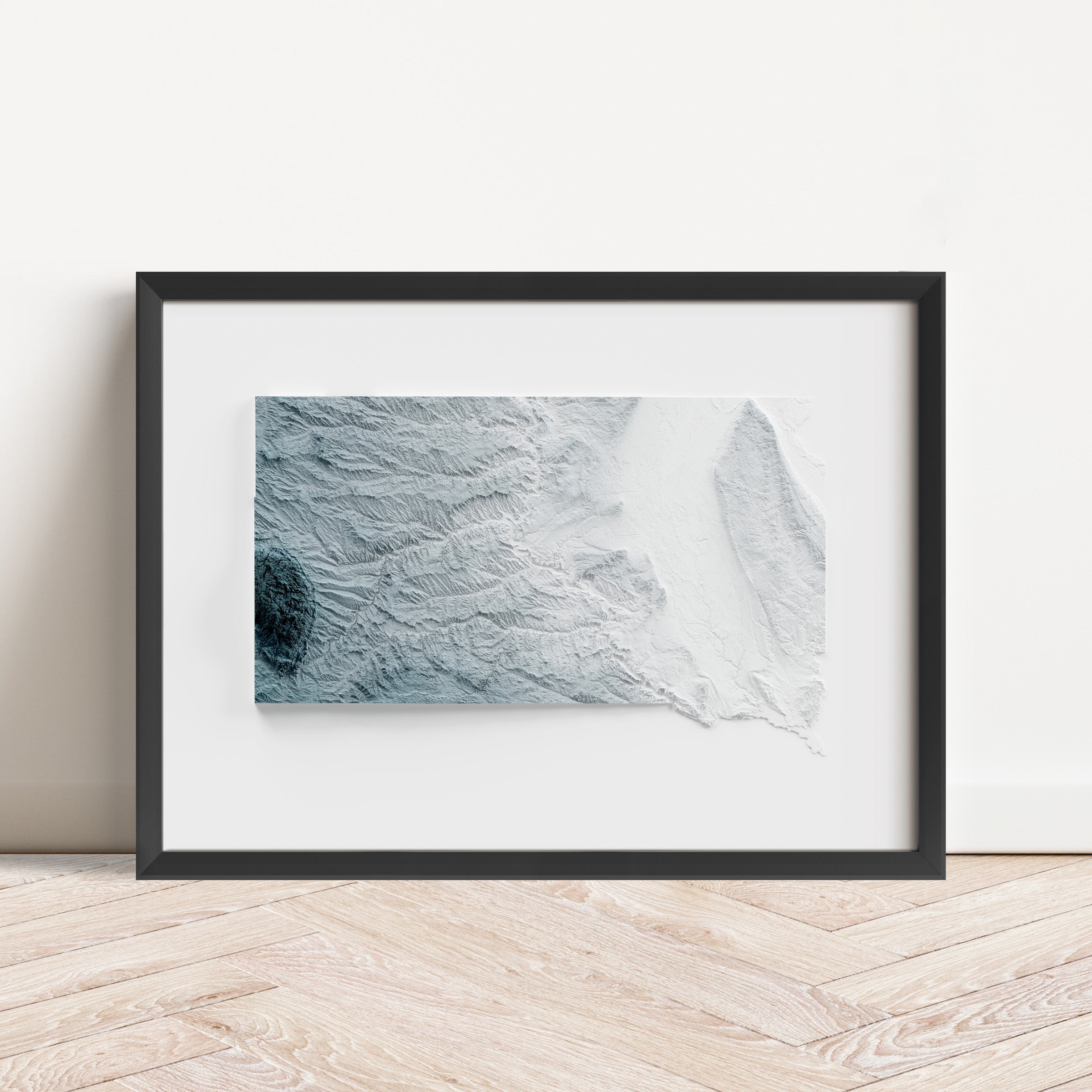 Framed minimalist elevation map of South Dakota. Minimalist topographic map art featuring detailed topography, available as premium poster for home or office decor.