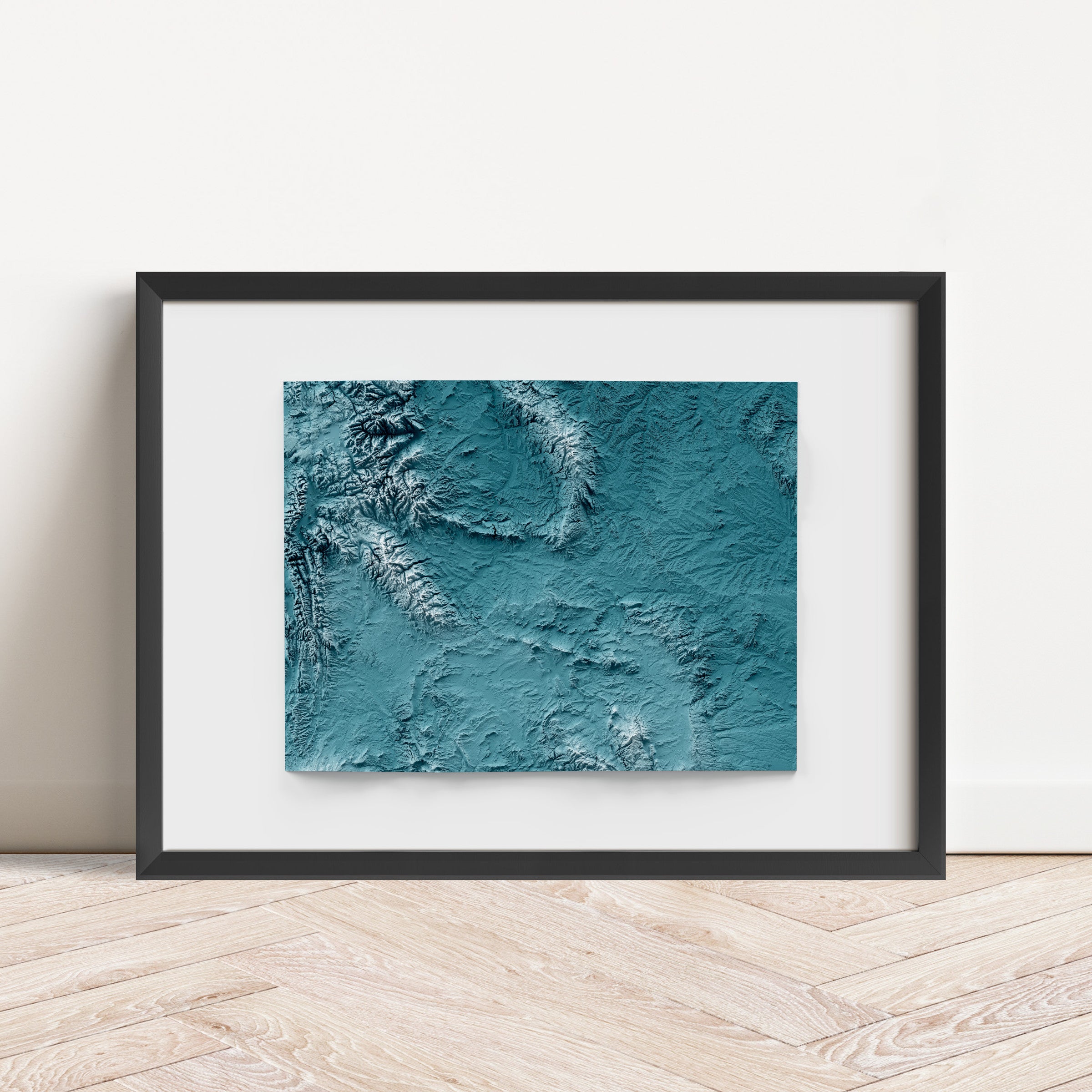 Framed minimalist elevation map of Wyoming. Minimalist topographic map art featuring detailed topography, available as premium poster for home or office decor.